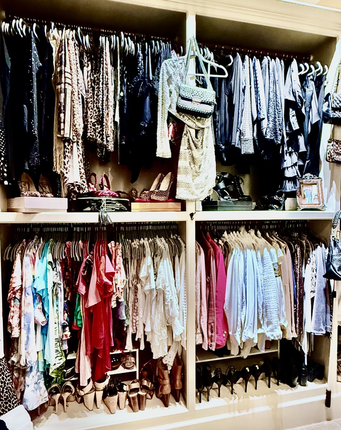 Full wardrobe wall organized by color and category