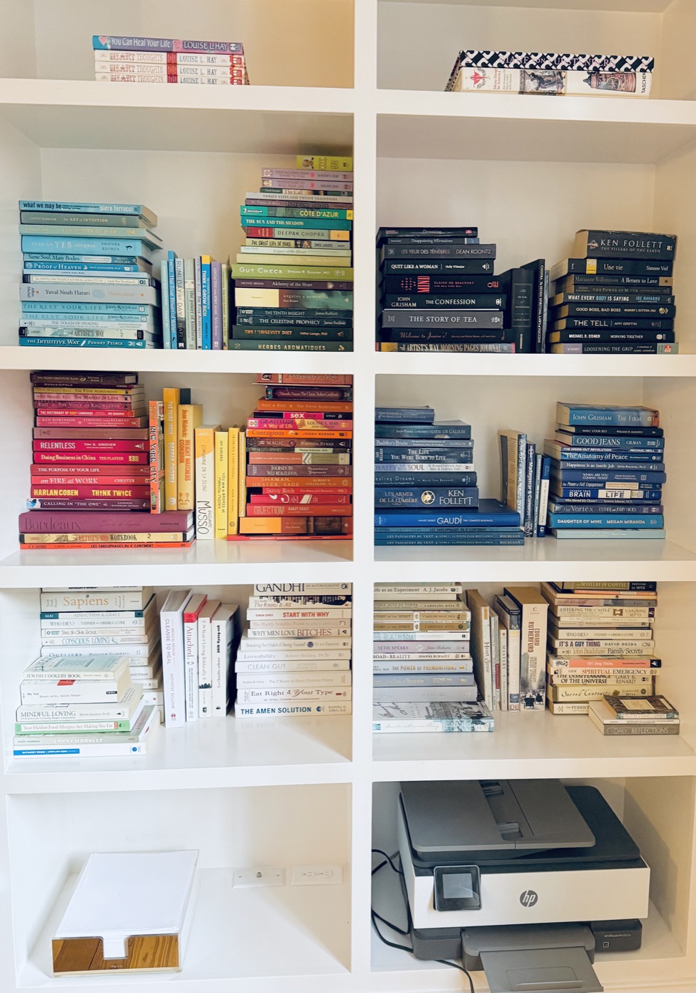Organized home library with books sorted by category