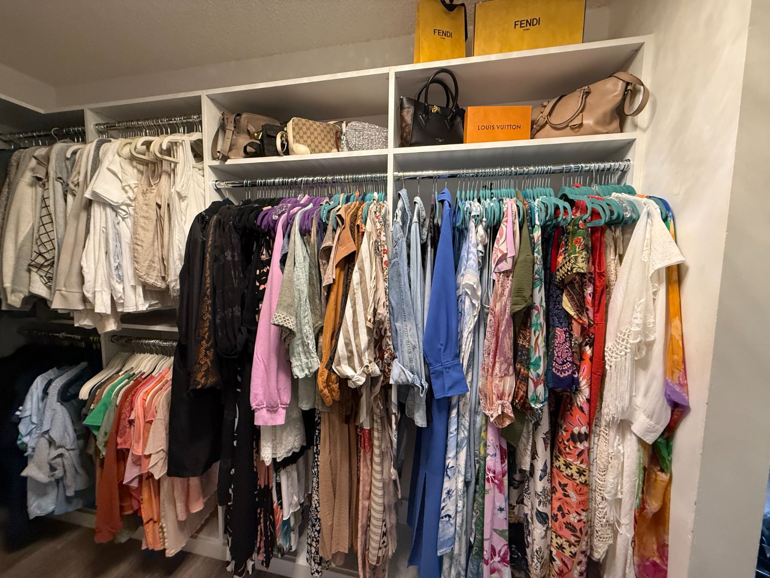 A colorful, beautifully organized walk-in closet